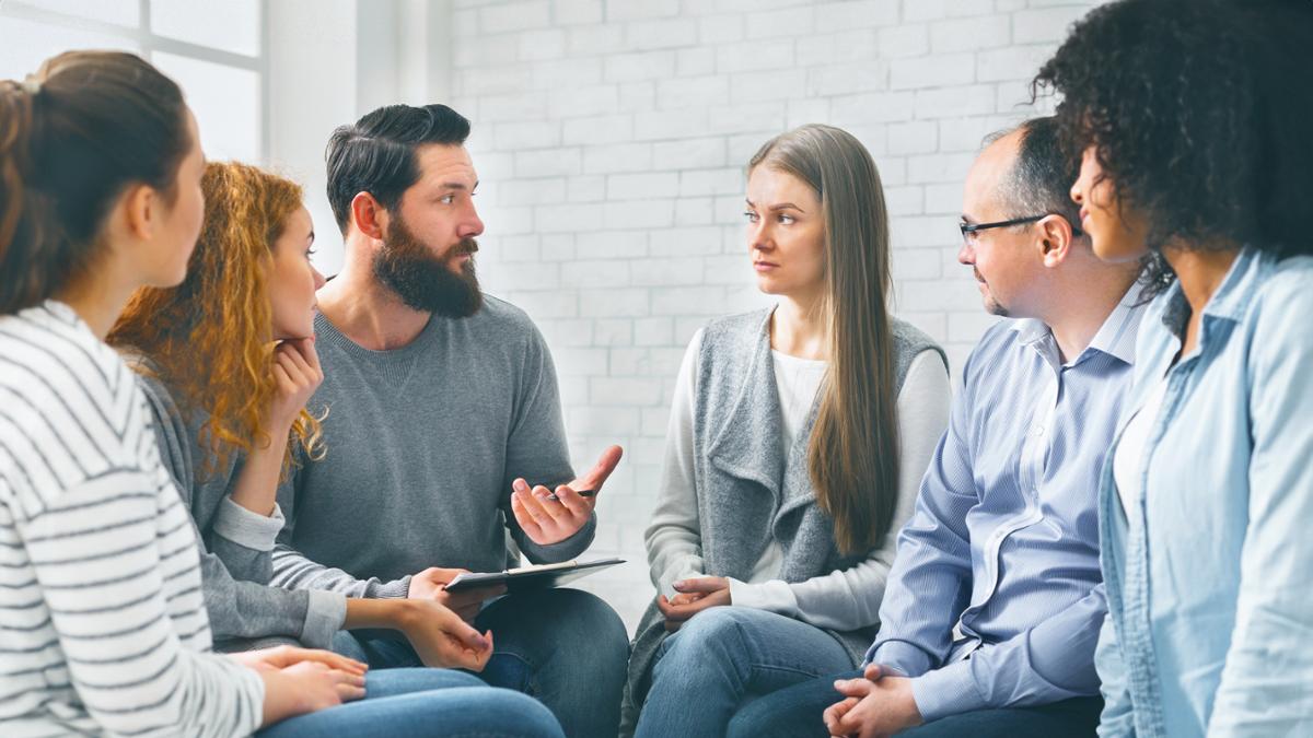 man talking to a group of people